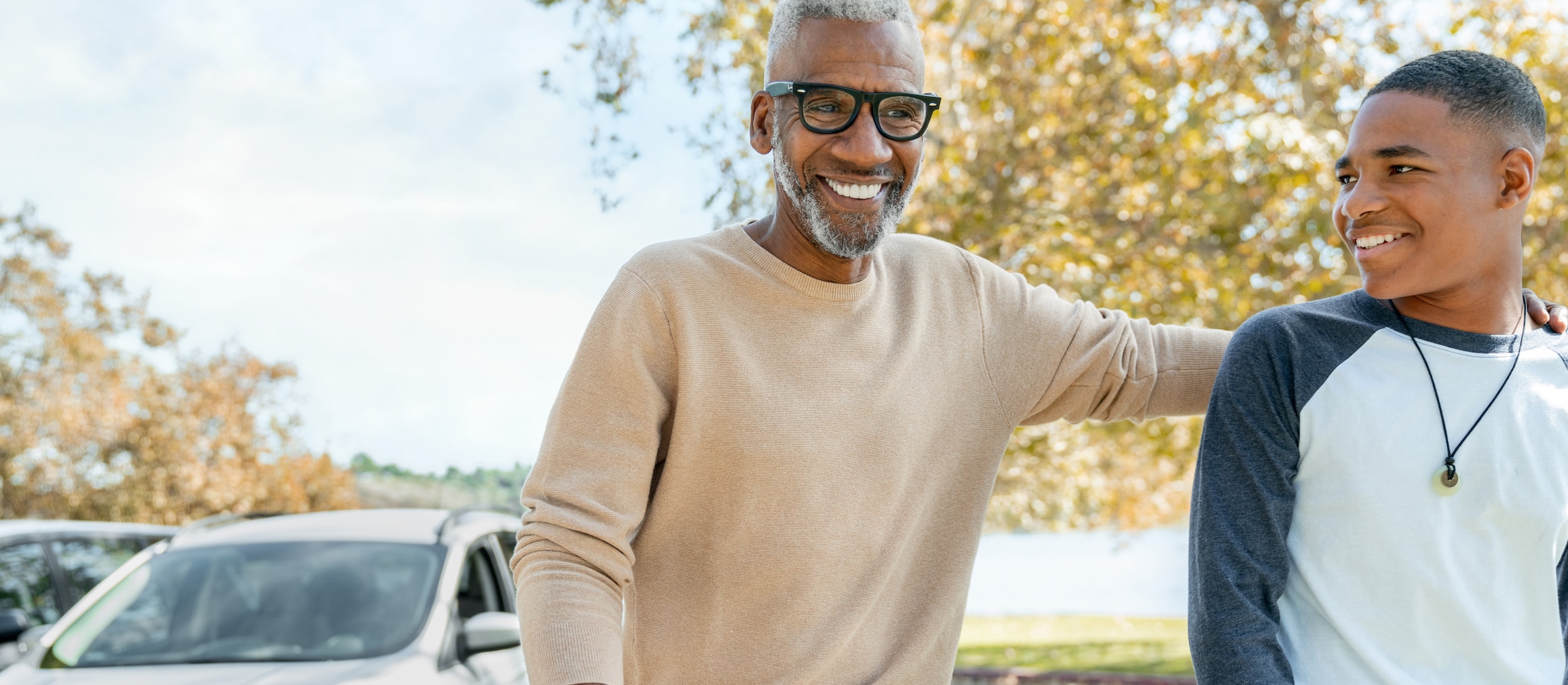 father and son smiling and laughing